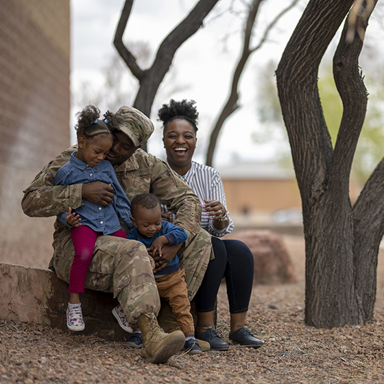 Military family posing for a photo.