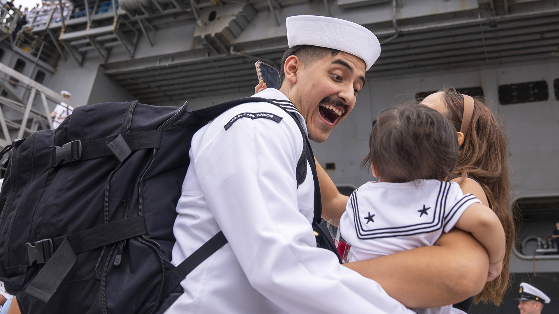 Sailor reunites with family.